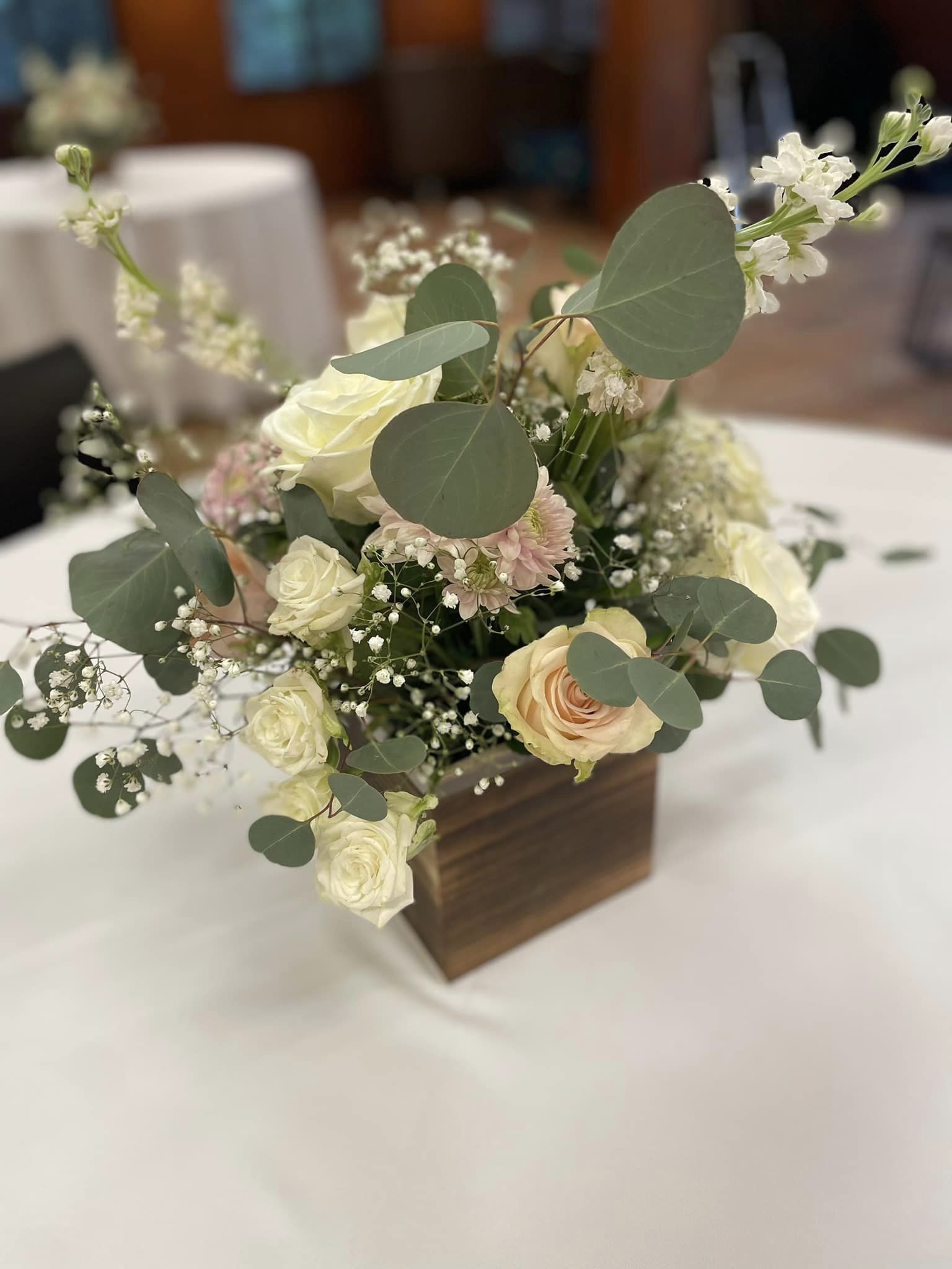 white wedding reception floral centerpiece in wooden box