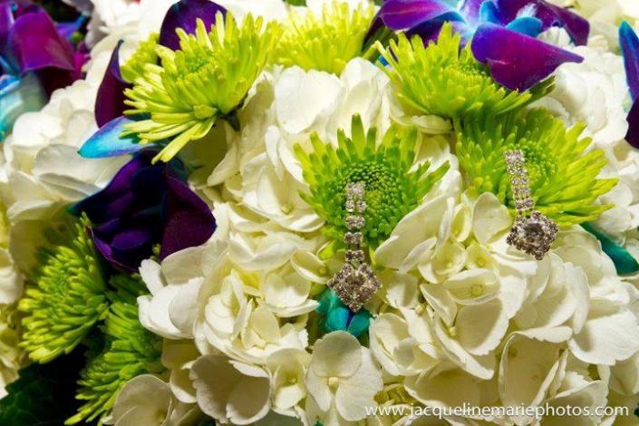 diamond earrings in green, white, and blue bouquet