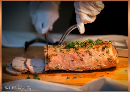 caterer slicing pork loin