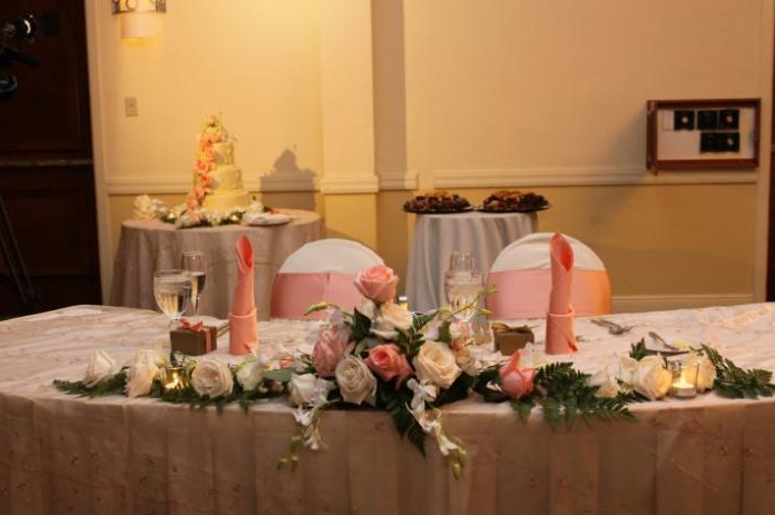 pink and white rose floral arrangement for wedding reception