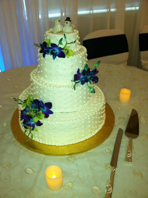 wedding cake with blue orchids