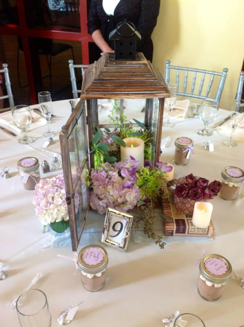 whimsical wedding reception centerpieces with lantern and flowers