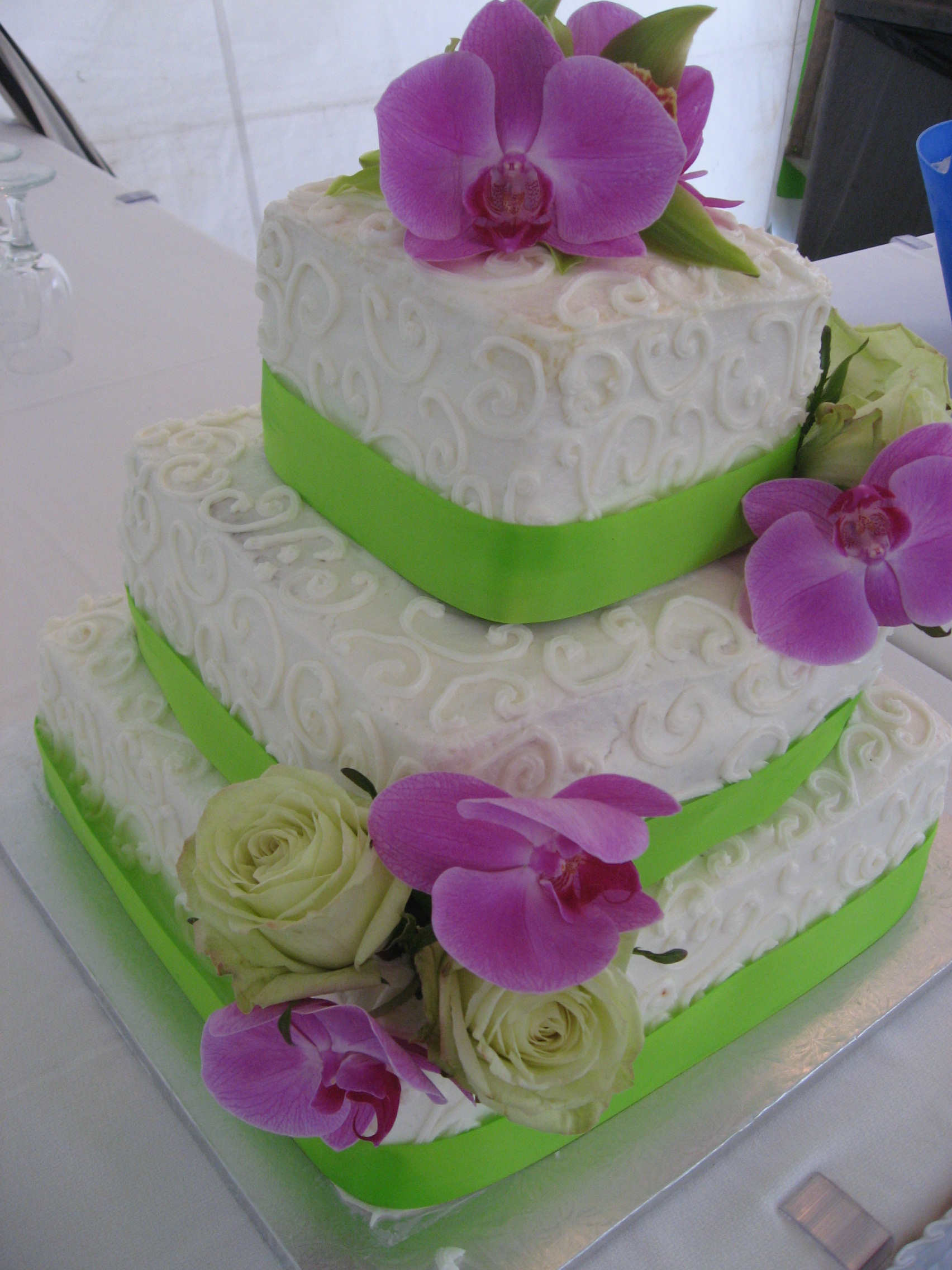 wedding cake with orchids and swirl designs